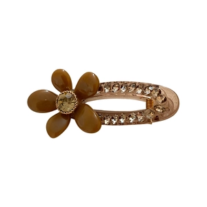 Elegant acrylic flower hair clip with brown petals and rhinestones on white background