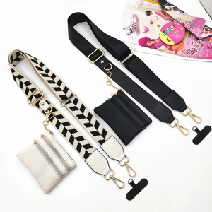 Adjustable crossbody phone strap with zippered pouch and black and white pattern