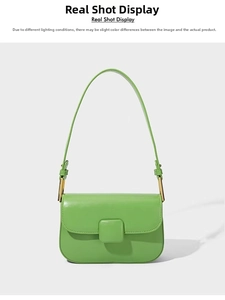 Detail view of the green shoulder bag featuring a square buckle and sleek leather texture