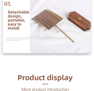 Detail view of walnut wood base and golden metal rod components for jewelry stand