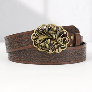 Vintage brown leather belt with embossed leaf pattern and ornate floral bee metal buckle
