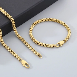 Detailed shot of gold-plated stainless steel necklace and bracelet with lobster clasps