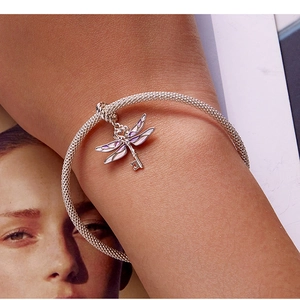 Detailed view of s925 silver mesh bracelet featuring a purple dragonfly key charm