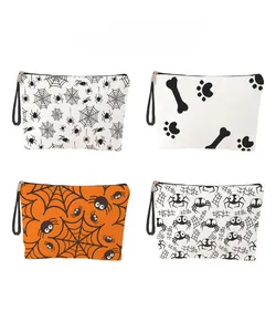 Detailed pattern display of Halloween cosmetic bags with spider web and claw prints