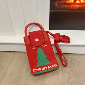 Detail of red knit Christmas tree phone bag with festive Merry Christmas embroidery