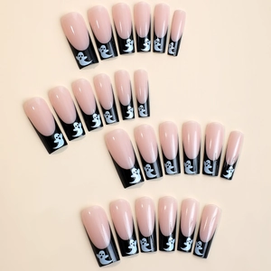 Halloween ghost press-on nails with nude base, black French tips and ghost patterns