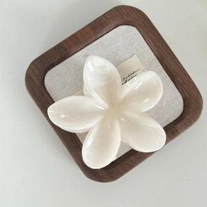 Elegant pearl white plumeria flower hair claw clip in a large size for ponytail styling