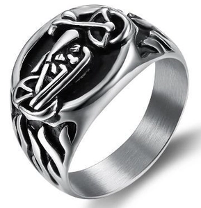 Macro detail of silver biker ring with vintage motorcycle relief in stainless steel finish