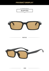 Detail view of vintage square sunglasses with black frame and tea-colored lenses