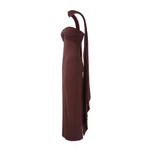 Side view of brown halter neck bodycon maxi dress with backless twisted scarf detail