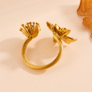 Close-up of golden rose ring with S925 hallmark on the inner band showing fine texture