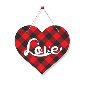 Detail of buffalo plaid heart hanging sign with white Love lettering and arrow design