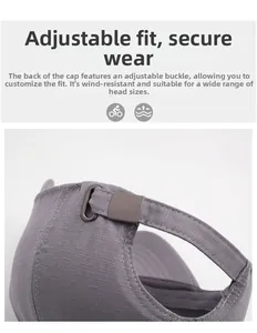 Detail of adjustable metal buckle and textured gray fabric on the baseball cap