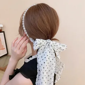 Elegant pearl headband with black and white polka dot chiffon ribbon tassel decoration