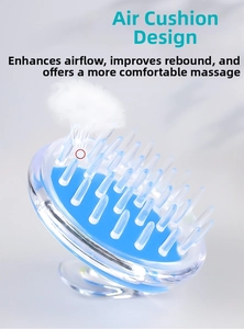 Detail of blue scalp massage brush showing the buffer airbag design for enhanced rebound