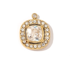 Macro view of gold stainless steel pendant with large faceted zircon and halo gems