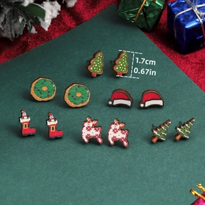 Detail of Christmas stud earrings set showing 1.7cm height of reindeer and tree patterns