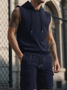 Detail of navy blue hooded gym set showing soft knit texture and muscle-fit silhouette