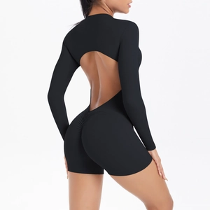 Detail of the open back cutout and scrunch butt design on the black fitness romper