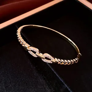 Polished 18K gold plated interlocking chain bangle with sparkling zircon pavé in a gift box