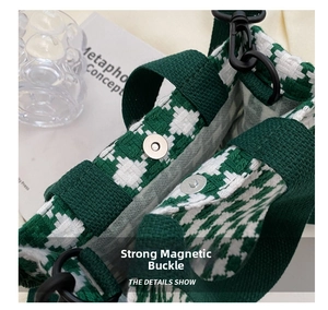 Close-up of a green houndstooth canvas bag featuring a strong magnetic snap closure detail