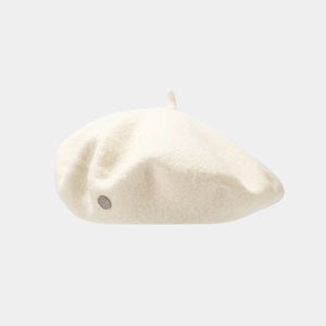 Detailed texture of cream wool beret featuring a signature round silver metal logo button