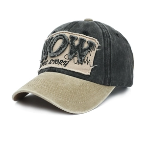 Detail of vintage washed baseball cap featuring 3D NOW embroidery and frayed patch