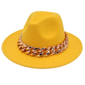 Detail of wide brim yellow wool fedora hat featuring a chunky gold acrylic chain link