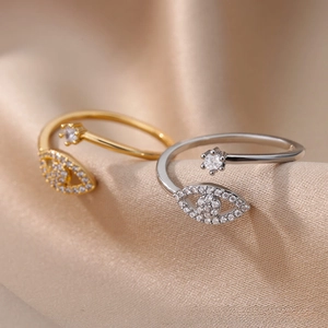 Macro shot of gold and silver open rings with marquise and round cubic zirconia stones