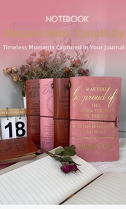 Close-up of vintage leather traveler journal with gold foil quote and elastic strap