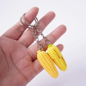 Realistic mini yellow corn keychain set with detailed texture and silver metal rings