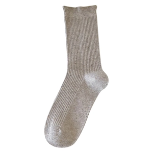 Grey rib-knit crew socks with Japanese ballet style colorful speckled yarn on white background