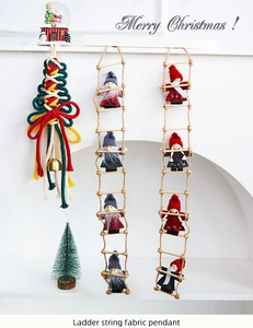 Detailed close-up of wool felt Santa ornaments and woven tree on a festive mantel