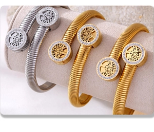 Macro shot of Tree of Life bangles with crystals on luxury jewelry roll display