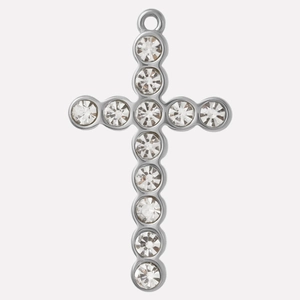 Macro detail of silver cross pendant with inlaid clear crystals on 304 stainless steel