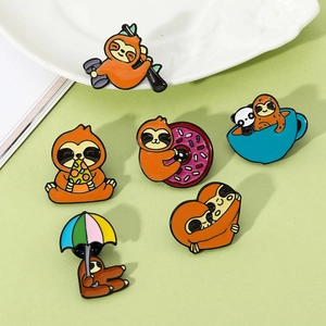 Macro shot of six assorted enamel sloth pins showing pizza, donut, and umbrella details