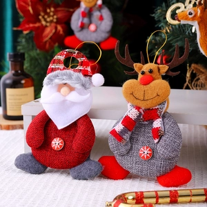 Detail of plush Santa and Reindeer ornaments with knitted textures and button accents