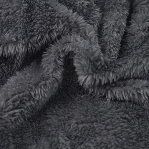 Close-up of deep gray plush fleece lining texture for winter knitted hat warmth