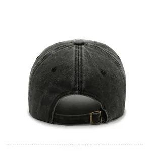 Detail view of the back of a washed denim baseball cap with an adjustable metal buckle