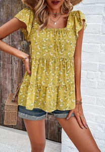 Close-up of yellow floral chiffon top featuring square neckline and ruffle sleeves on model