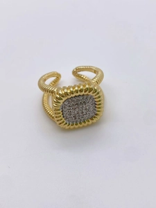 Macro view of gold plated twisted rope ring with square pave set cubic zirconia stones