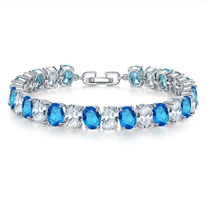 Close-up of luxury copper plated bracelet with blue and white oval-cut zircon stones