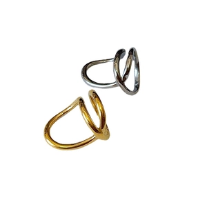 Minimalist irregular twisted double layer rings in gold and silver finish on white background
