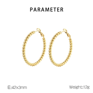 Macro detail of 18K gold-plated twisted hoop earrings measuring 42mm in diameter