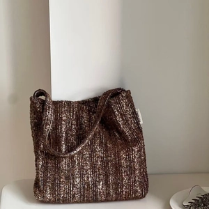 Vintage dark brown tweed knit tote bag with shoulder strap in a minimalist setting