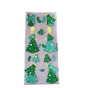 Transparent Christmas sticker sheet with green trees and festive holiday motifs