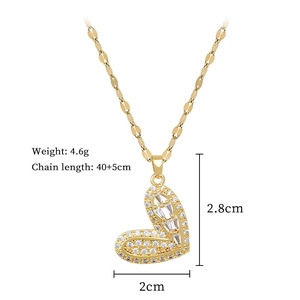 Detail shot of a gold heart pendant with micro-pave crystals and flat link chain