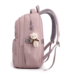 Side view of pink lightweight nylon backpack with cute bear pendant and breathable mesh straps
