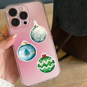 Detail of Christmas ornament graphic pattern on clear iPhone case with star and tree designs