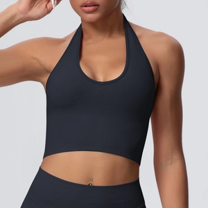 Detail of black halter yoga bra featuring breathable ribbed fabric and deep V-neckline cut